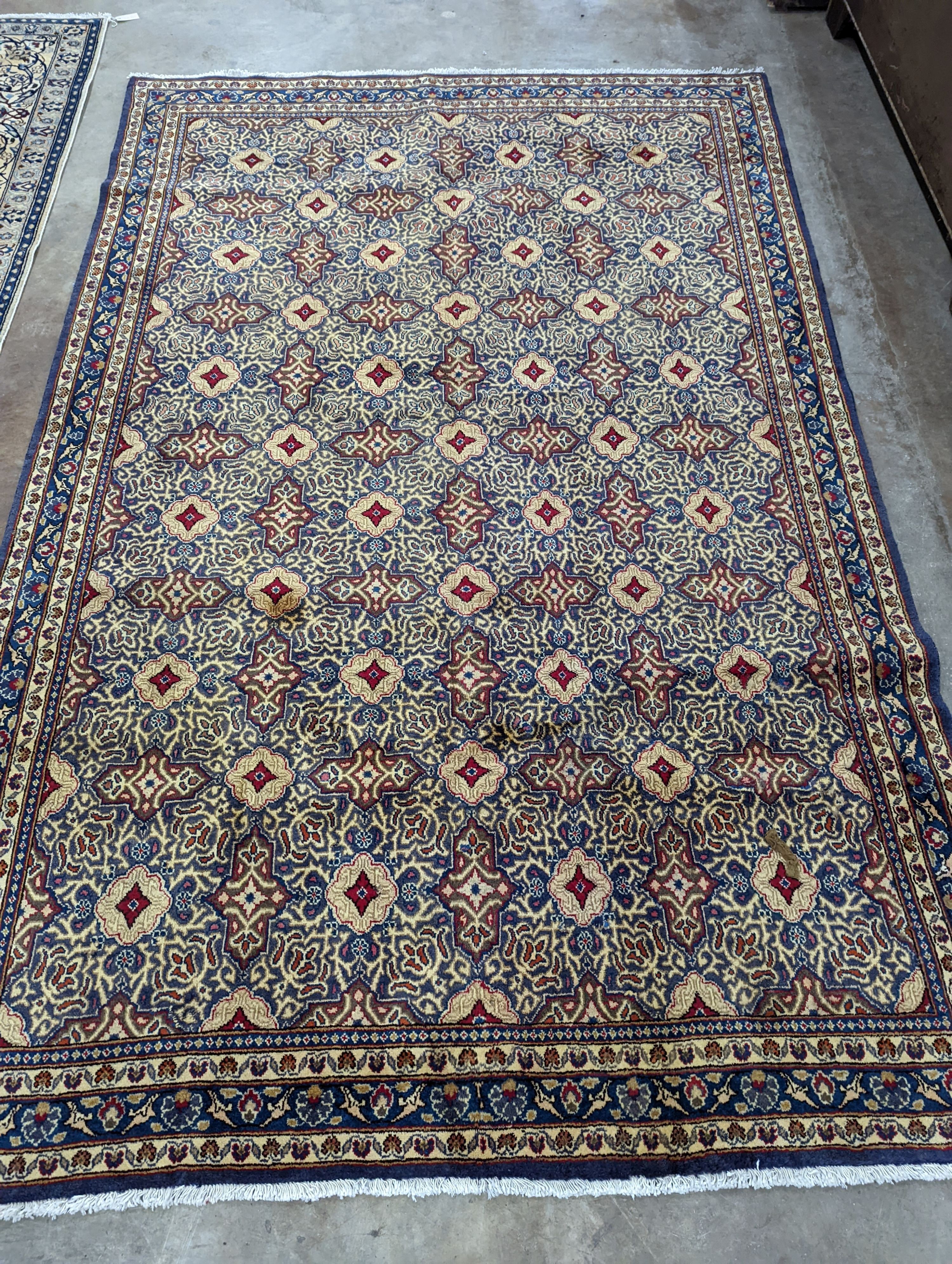 A meshed blue ground carpet, 290 x 190cm